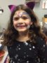 school_age_girl_with_rainbow_facepaint_cadence_academy_preschool_montgomery_il-333x450