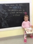 silly_2-year-old_girl_standing_next_to_chalkboard_next_generation_childrens_centers_beverly_ma-336x450