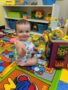 smiling_infant_creative_kids_childcare_centers_beekman-338x450