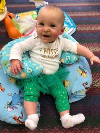smiling_infant_sitting_in_lounge_cushions_prime_time_early_learning_centers_farmingdale_ny-338x450