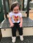 smiling_little_girl_on_playground_at_sunbrook_academy_at_woodstock_ga-338x450