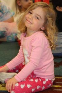smirking_preschool_girl_at_learning_edge_childcare_and_preschool_new_berlin_wi-298x450