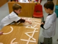 spelling_with_wood_pieces_at_next_generation_childrens_centers_walpole_ma-600x450