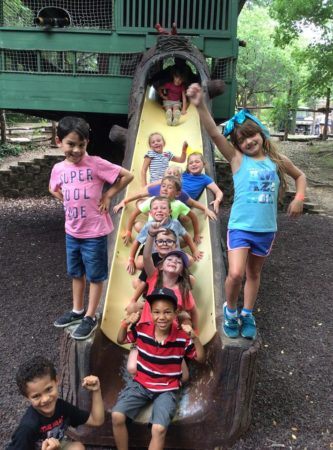 summer_campers_enjoying_slide_at_the_zoo_the_peanut_gallery_temple_tx-333x450