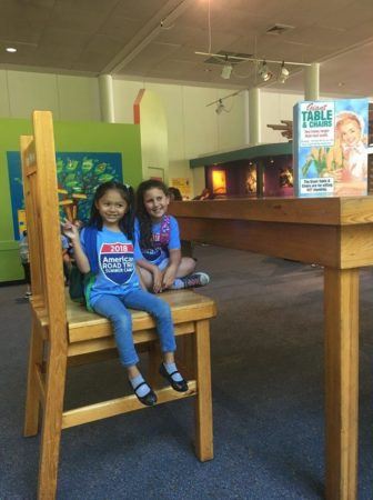 summer_campers_sitting_on_giant_chair_cadence_academy_preschool_sleater-kinney_olympia_wa-336x450