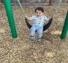 child swinging in playground at cadence academy preschool and daycare in dupont washington