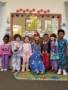 teacher_and_preschool_children_in_pajamas_at_cadence_academy_preschool_grand_prairie_tx-338x450