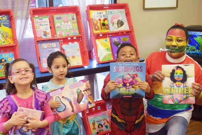 teacher_and_students_with_books_at_cadence_academy_preschool_mauldin_sc-675x450