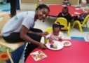 teacher_and_toddler_enjoying_meal_at_cadence_academy_preschool_harbison_columbia_sc-634x450