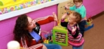 teacher_and_toddler_high_fiving_prime_time_early_learning_centers_middletown_ny-752x353