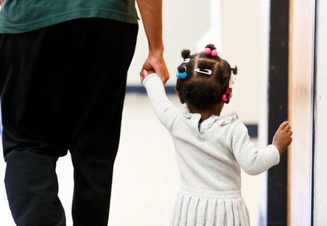 teacher_and_toddler_holding_hands_cadence_academy_romeoville_il-652x450