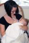 teacher_feeding_infant_cadence_academy_preschool_fayetteville_ar-300x450