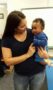 teacher_holding_toddler_at_cadence_academy_preschool_flower_mound_tx-267x450