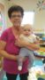 teacher_holding_toddler_winwood_childrens_center_gainesville_va-253x450