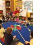 teacher_putting_geometric_shapes_on_whiteboard_winwood_childrens_center_gainesville_ii_va-333x450