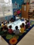 teacher_reading_book_to_preschoolers_winwood_childrens_center_gainesville_ii_va-338x450