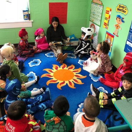 teacher_reading_to_preschoolers_in_costume_prime_time_early_learning_centers_edgewater_nj-450x450
