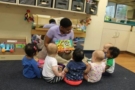 teacher_reading_to_toddlers_at_cadence_academy_preschool_dallas_tx-675x450