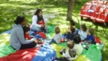 teachers_reading_to_toddlers_at_the_park_prime_time_early_learning_centers_hoboken_nj-752x423