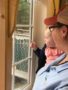 toddler_and_teacher_looking_out_the_window_cadence_academy_preschool_smithfield_ri-338x450