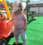 toddler_barefoot_on_playground_at_cadence_academy_preschool_bourne_ma-428x450