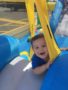 toddler_boy_enjoying_bounce_house_prime_time_early_learning_centers_farmingdale_ny-338x450