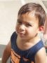 toddler_boy_looking_stern_on_playground_at_cadence_academy_preschool_carmichael_ca-336x450