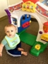toddler_boy_playing_with_door_toy_cadence_academy_preschool_rosemeade_carrollton_tx-338x450