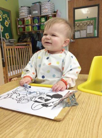 toddler_boy_smiling_while_coloring_carolina_kids_child_development_center_rock_hill_sc-333x450