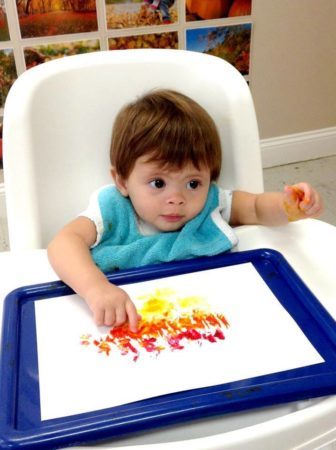 toddler_doing_finger_paint_cadence_academy_preschool_kenton_huntersville_nc-336x450
