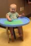 toddler_drawing_in_high_chair_creative_expressions_learning_center_eureka_mo-307x450