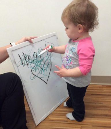 toddler_drawing_on_heart_cadence_academy_preschool_austin_cedar_park_tx-386x450