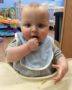 toddler_eating_in_high_chair_cadence_academy_preschool_lincoln_ri-360x450