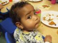 toddler_eating_thanksgiving_dinner_at_cadence_academy_preschool_carmichael_ca-600x450