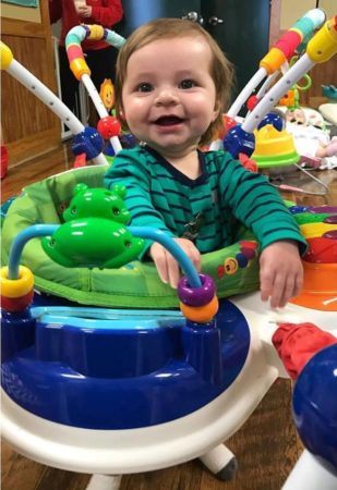 toddler_enjoying_a_bouncy_toy_bearfoot_lodge_private_school_wylie_tx-309x450