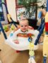 toddler_enjoying_activity_center_at_cadence_academy_eastfield_huntersville_nc-338x450