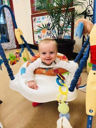 toddler_enjoying_activity_center_at_cadence_academy_eastfield_huntersville_nc-338x450