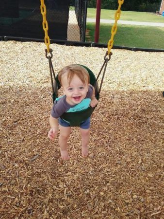 toddler_enjoying_swing_at_sunbrook_academy_at_luella_mcdonough_ga-338x450