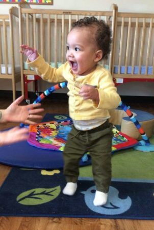 toddler_excited_to_be_walking_cadence_academy_preschool_raynham_ma-302x450