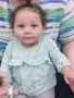 toddler_girLsitting_on_teachers_lap_rogys_learning_place_hilltop_peoria_il-338x450