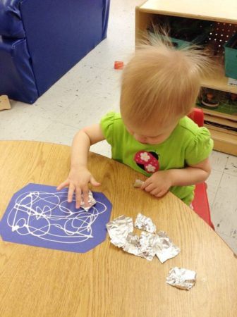 toddler_girl_doing_foil_art_project_at_cadence_academy_preschool_kenton_huntersville_nc-336x450