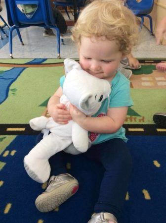 toddler_girl_holding_kitty_stuffed_animal_at_cadence_academy_preschool_mauldin_sc-336x450