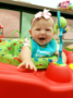 toddler_girl_in_play_area_rogys_learning_place_hilltop_peoria_il-336x450