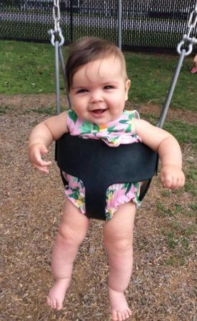 toddler_girl_in_swing_at_cadence_academy_preschool_mauldin_sc-276x450