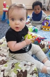 toddler_girl_looking_amazed_at_cadence_academy_plymouth_meeting_pa-289x450