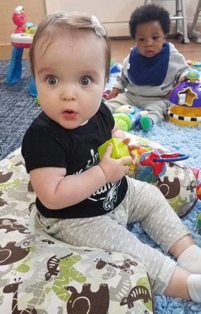 toddler_girl_looking_amazed_at_cadence_academy_plymouth_meeting_pa-289x450