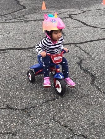 toddler_girl_on_tricycle_growing_kids_academy_fredericksburg_va-338x450