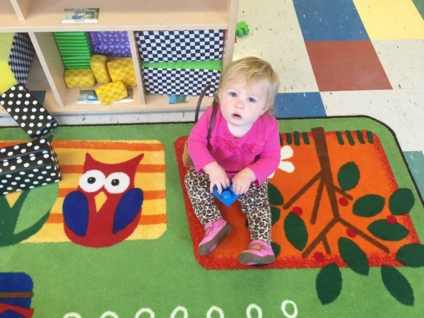 toddler_girl_playing_with_large_block_at_cadence_academy_preschool_lexington_sc-600x450