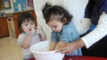 toddler_girls_getting_dirty_during_cooking_activity_prime_time_early_learning_centers_edgewater_nj-752x423