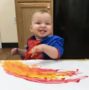 toddler_having_fun_fingerpainting_cadence_academy_preschool_lincoln_ri-445x450